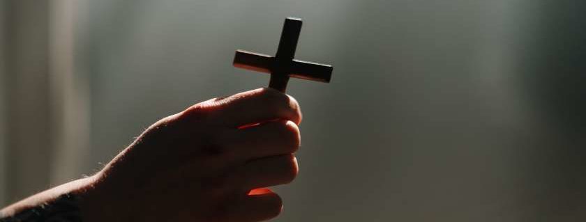 Hand With Cross and Prayers for Strength