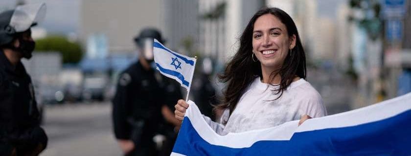 woman holding israel flag and prayer for israel