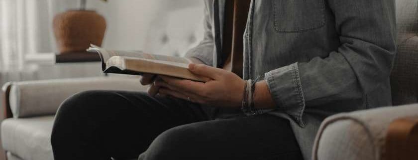 Person Reading Bible And The Promises Of God