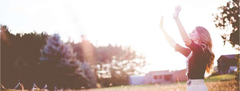 woman raising her arms and righteousness of god