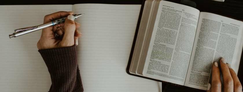 woman with a pen a notebook and bible and 333 meaning bible