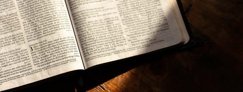bible on table with shadow and 777 meaning bible