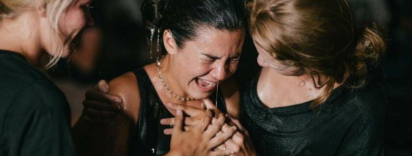 women doing water baptism and born of god