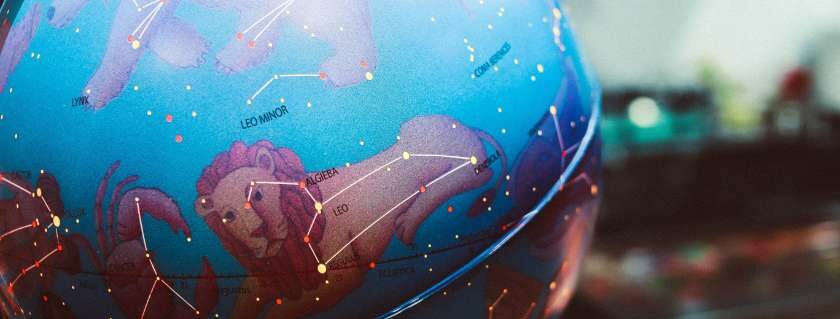 globe with zodiac signs