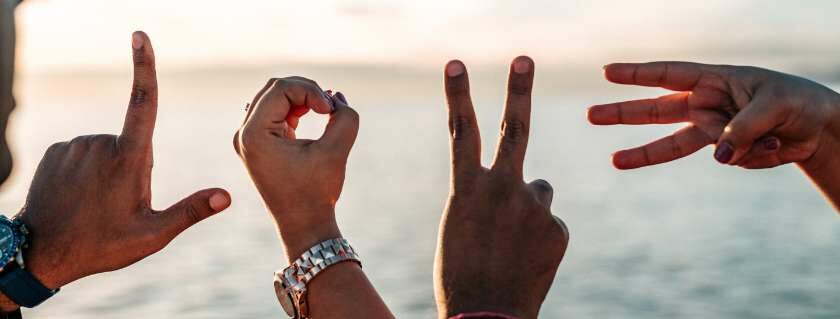 love spelled out by four hands